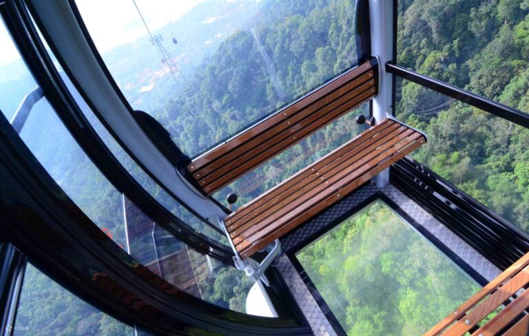 An inside view of wooden bench seat of a gondola cable car